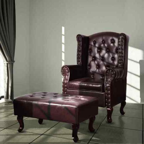 poltrona chesterfield elegante con braccioli poggiapiedi in